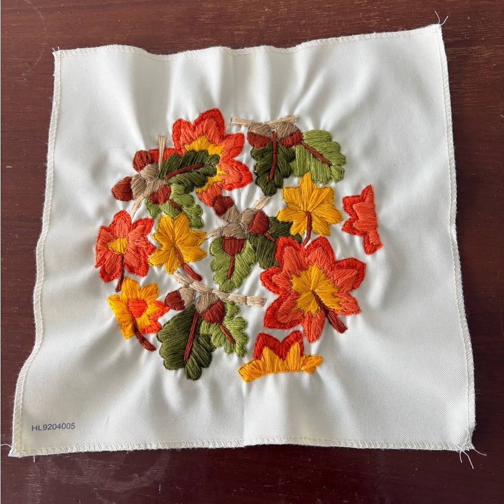 Embroidered autumn leaf artwork